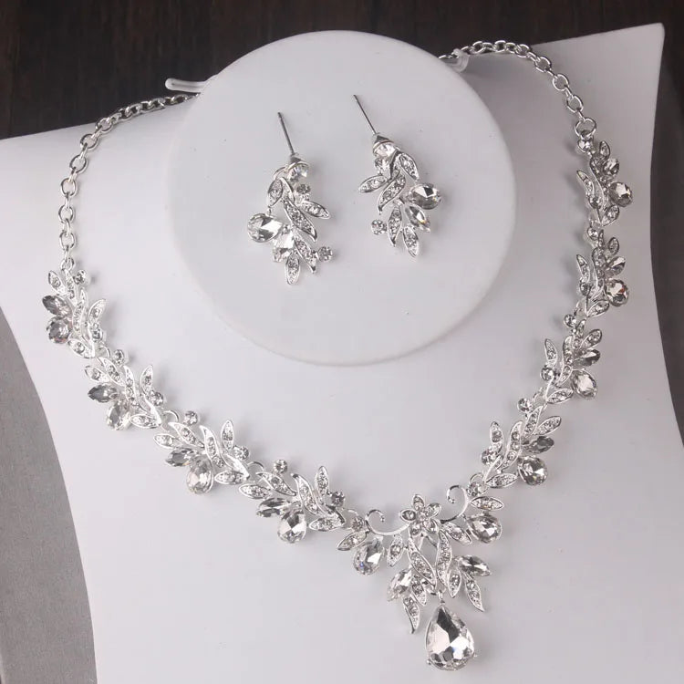 Alt Tag: silver crystal leaf bridal jewelry set necklace and earrings with rhinestone leaf design and teardrop pendant for wedding