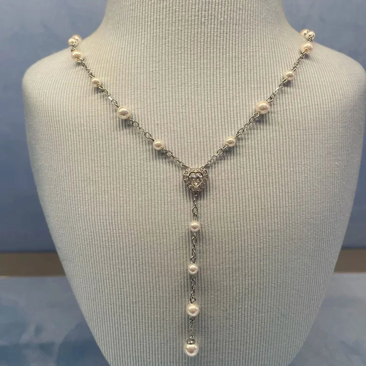Alt Tag: pearl jewelry set wholesale for weddings pearl drop Y necklace with beaded chain and pendant on display bust