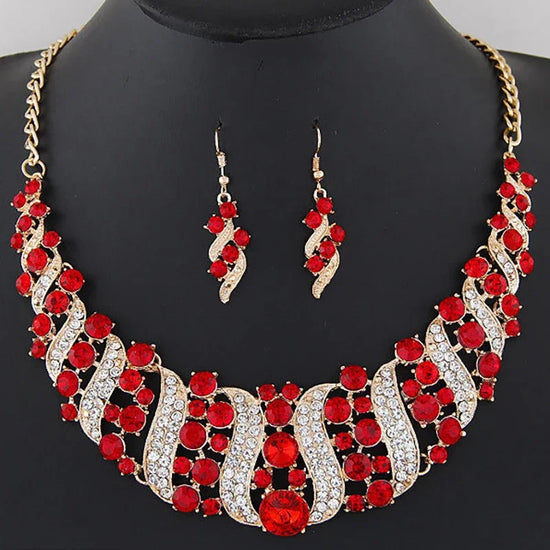 crystal bridal necklace and earrings set with red and clear rhinestones, gold chain statement necklace and matching drop earrings