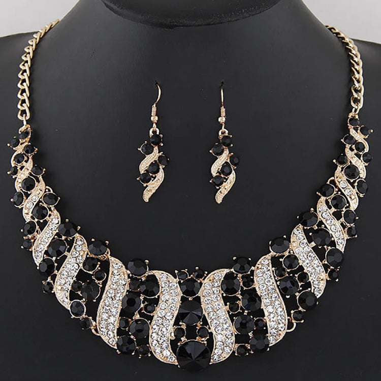 crystal bridal necklace and earrings set with black and clear rhinestones, statement wedding jewelry on display bust