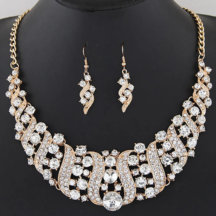 Alt Tag: crystal bridal necklace and earrings set with rhinestone statement necklace and matching drop earrings on display bust