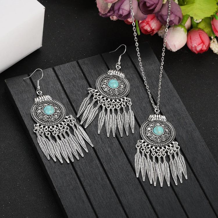 Alt Tag: silver plated turquoise indian jewelry set with dangling feather earrings and matching pendant necklace