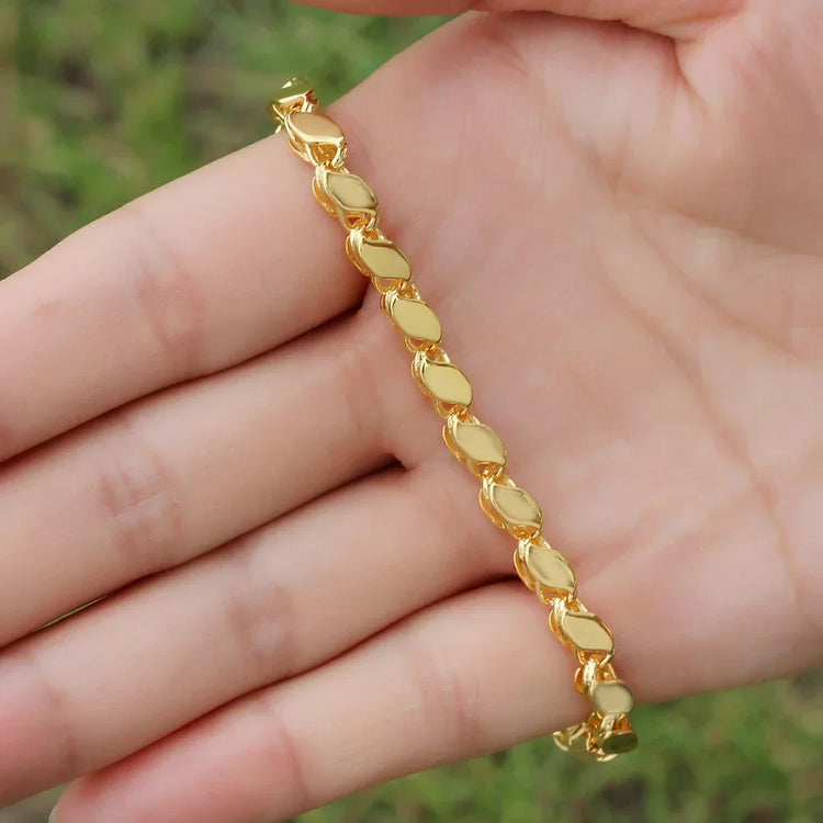 gold Islamic necklace 70cm displayed in a hand, featuring a stylish design and shiny finish.