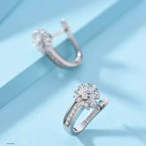 Alt Tag: 925 sterling silver zircon flower earrings in floral cluster design, sparkling zircon stones, elegant silver hoop style on blue background