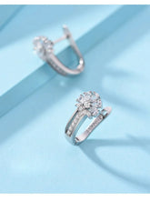 Alt Tag: 925 sterling silver zircon flower earrings hoop huggie style with sparkling flower cluster and pavé band on blue background