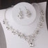 Alt Tag: silver crystal leaf bridal jewelry set necklace and earrings with rhinestone leaf design and teardrop pendant for wedding