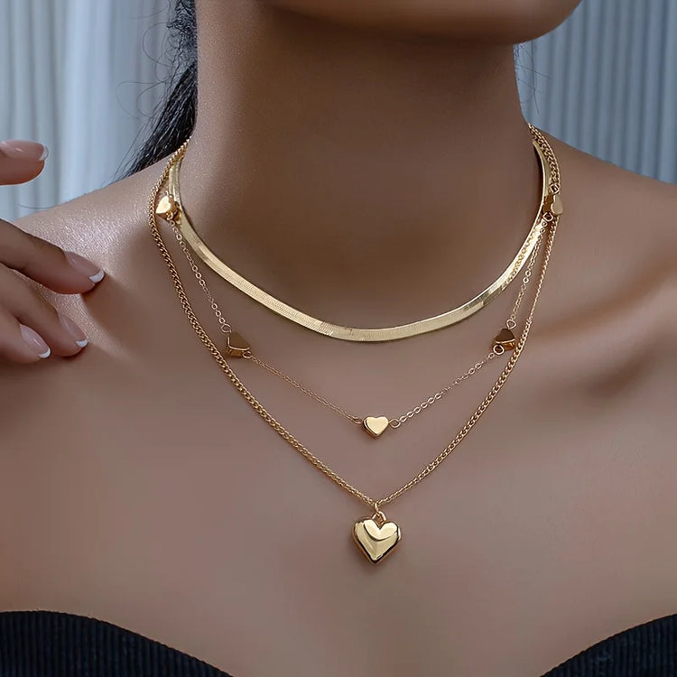 Alt Tag: 54 piece fashion jewelry set layered gold heart pendant necklace set on model, trendy fashion jewelry accessories