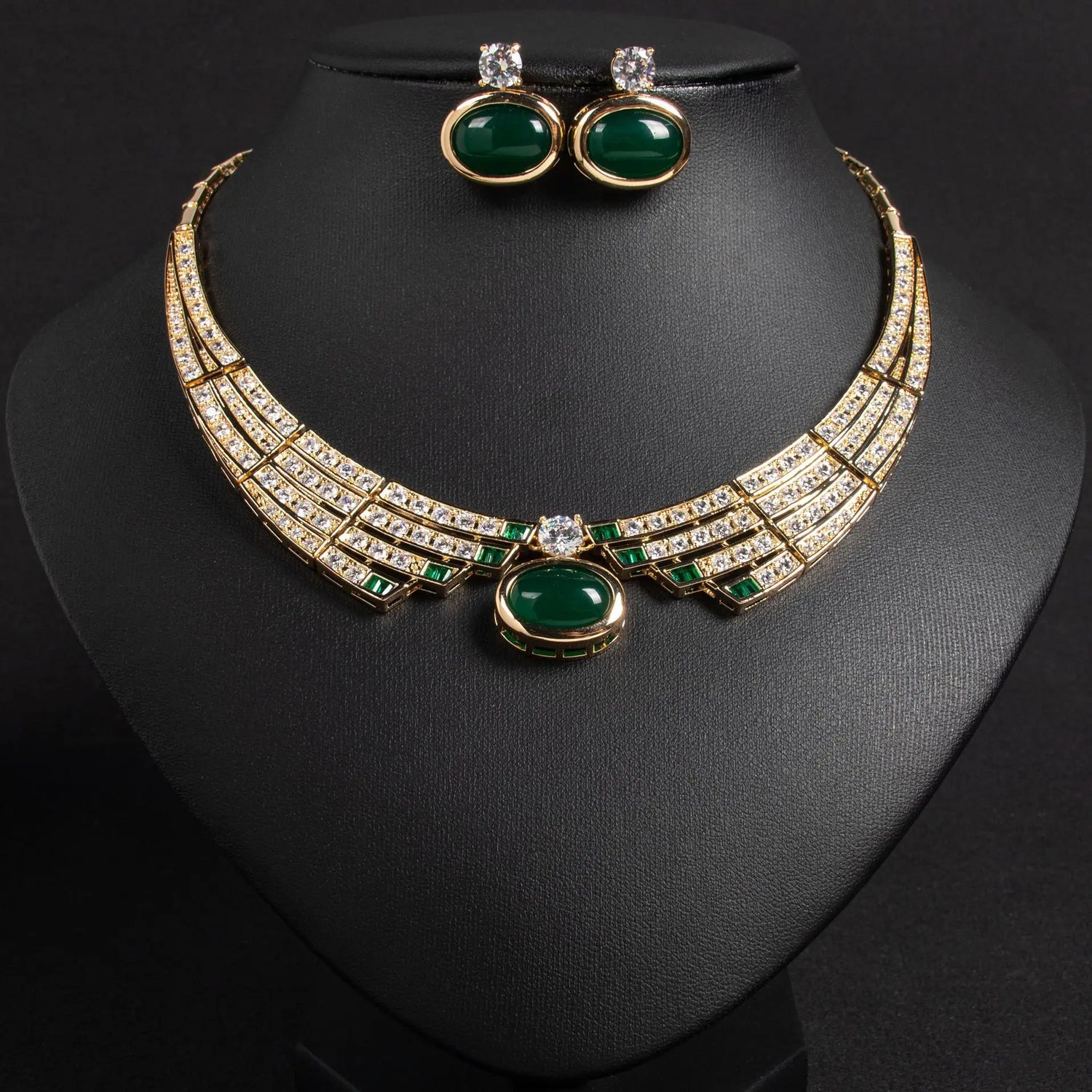 Alt Tag: bridal necklace and earrings set with green gemstone pendant, crystal choker necklace and matching stud earrings on display