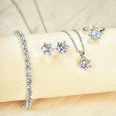 Alt Tag: 5 piece crystal jewelry set for women featuring bracelet, stud earrings, pendant necklace and ring