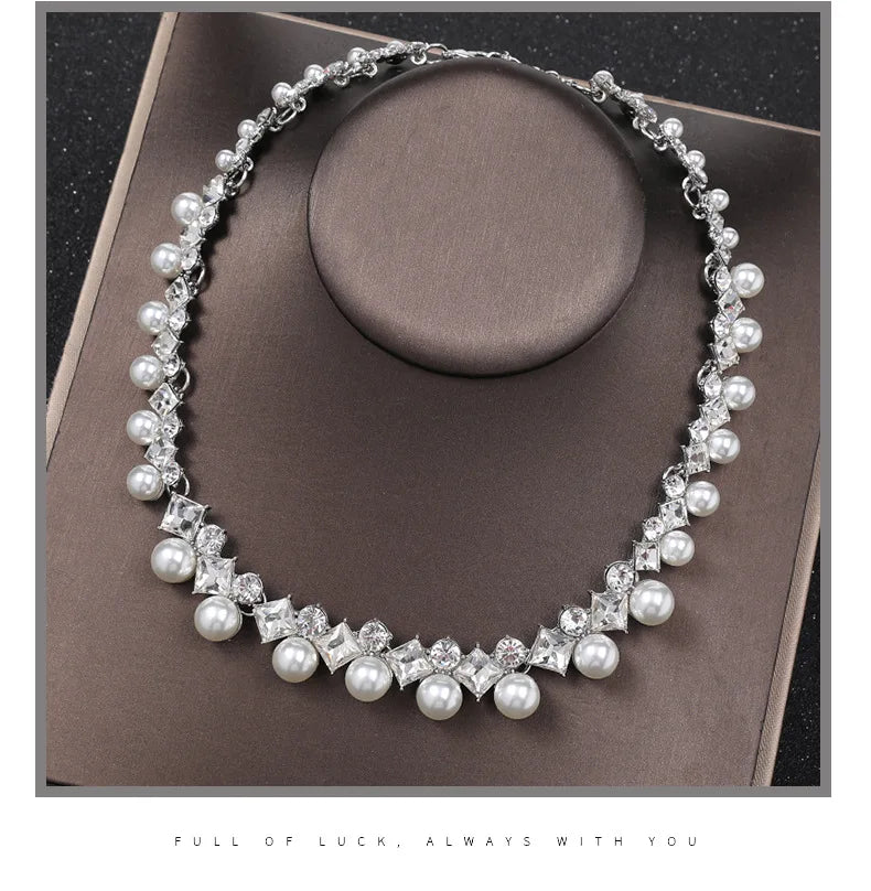 Alt Tag: pearl necklace and earrings set for women silver crystal chain with round faux pearls on display stand