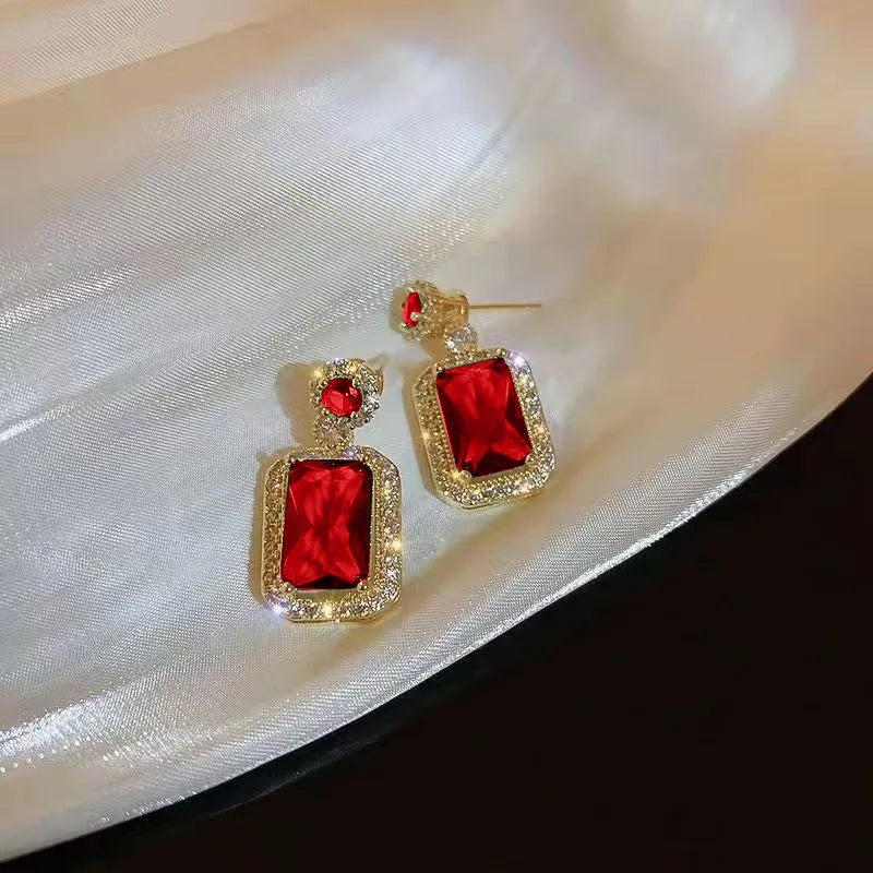 Alt Tag: titanium steel green zircon necklace for women - product image showing gold-tone red gemstone drop earrings with crystal halo