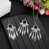 Alt Tag: silver plated turquoise indian jewelry set necklace and dangle earrings with black stone charms on black display