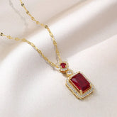titanium steel green zircon necklace for women - gold chain pendant necklace with red gemstone and crystal halo on satin background