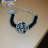 Alt Tag: crystal flower rhinestone choker necklace set with black velvet band and sparkling rhinestone rose centerpiece