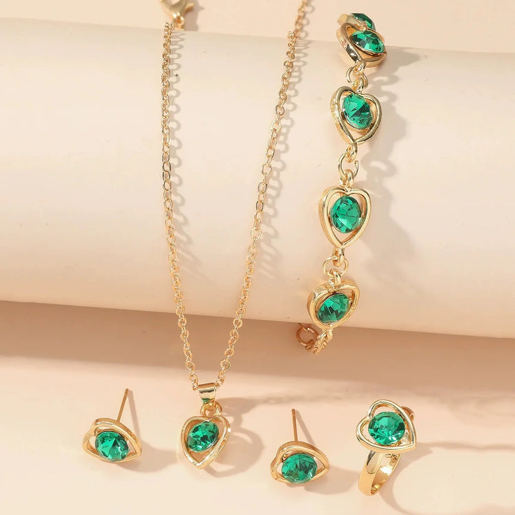 Alt Tag: heart crystal jewelry set for women gold-tone necklace bracelet earrings ring with green heart crystals