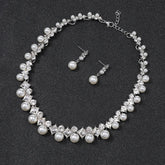 Alt Tag: pearl necklace and earrings set for women with crystal rhinestone choker and matching pearl drop stud earrings on black background