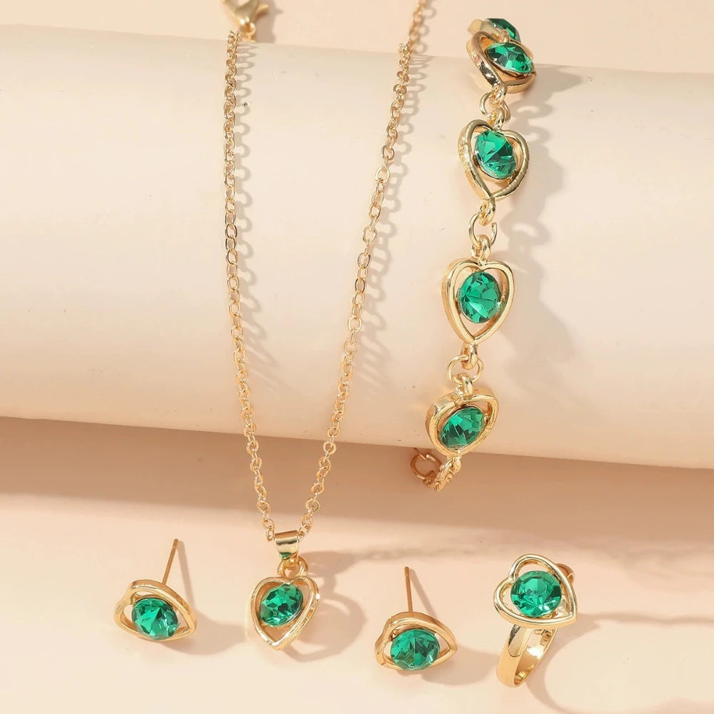 Alt Tag: heart crystal jewelry set for women gold necklace bracelet earrings ring with green heart crystals