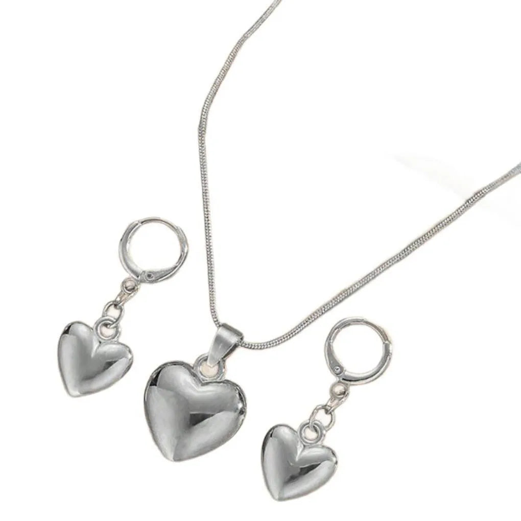 Alt Tag: gold plated heart dangle earrings necklace set with glossy heart pendant necklace and matching heart drop earrings for women