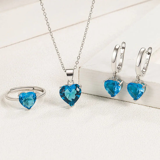 Alt Tag: heart zircon 925 silver bridal jewelry set with blue heart zircon necklace, ring and hoop earrings in sterling silver