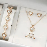 Alt Tag: heart crystal jewelry set for women with gold-tone heart crystal necklace, bracelet, earrings, and ring in gift box