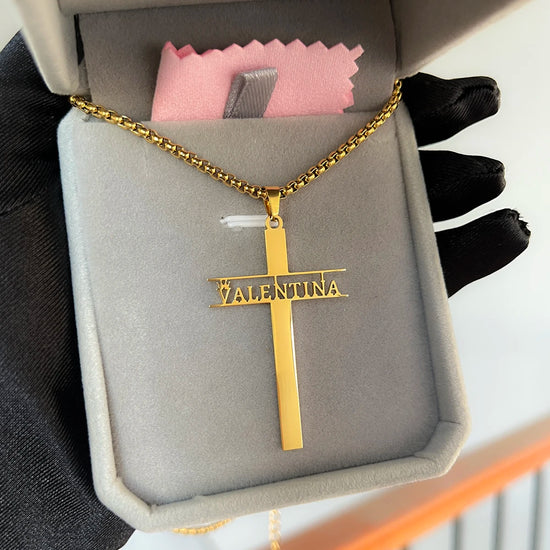 Custom stainless steel name necklace for women featuring a personalized gold cross pendant with the name Valentina.