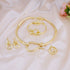 gold choker necklace jewelry set for women with matching bracelet, earrings and ring in shiny gold tone on satin backdrop
