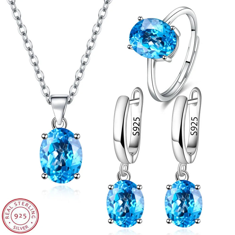 Alt Tag: 925 sterling silver bridal jewelry set with blue gemstone pendant necklace, ring, and drop earrings in 925 silver