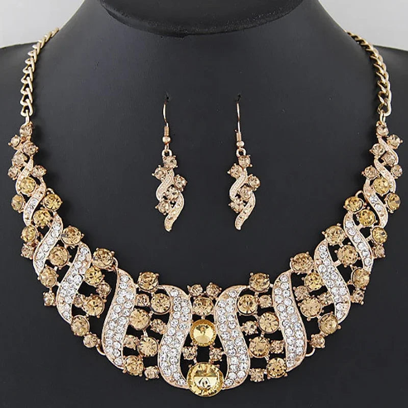 crystal bridal necklace and earrings set gold tone rhinestone wedding jewelry on black display bust