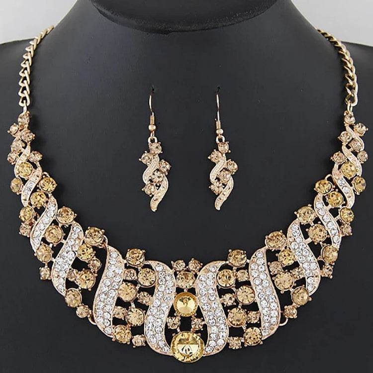 crystal bridal necklace and earrings set gold tone rhinestone wedding jewelry on black display bust