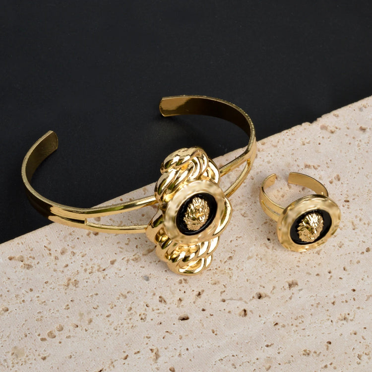 Alt Tag: 18k gold plated Dubai jewelry set for women gold cuff bracelet and matching ring on stone display