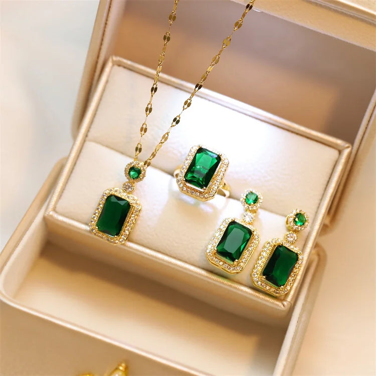 Alt Tag: titanium steel green zircon necklace for women with emerald green rectangular pendant, matching ring and earrings set in gift box