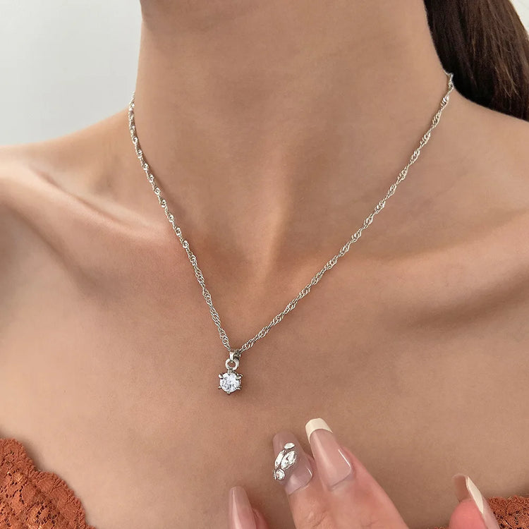 Alt Tag: 5 piece crystal jewelry set for women silver chain necklace with sparkling crystal pendant worn on neck