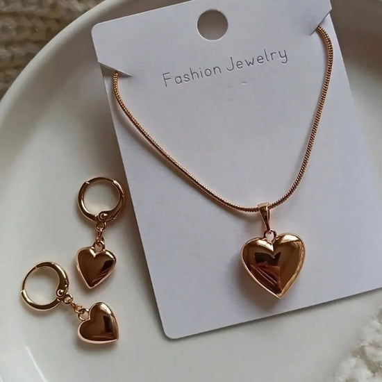 Alt Tag: gold plated heart dangle earrings necklace set with glossy heart pendant and matching dangle earrings on jewelry card