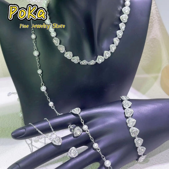 pearl jewelry set wholesale for weddings silver necklace bracelet and rings with pearls on display bust