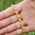 gold Islamic necklace 70cm displayed in a hand, highlighting its elegant design and shine.