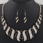 crystal bridal necklace and earrings set with black and clear rhinestones, statement wedding jewelry on display bust