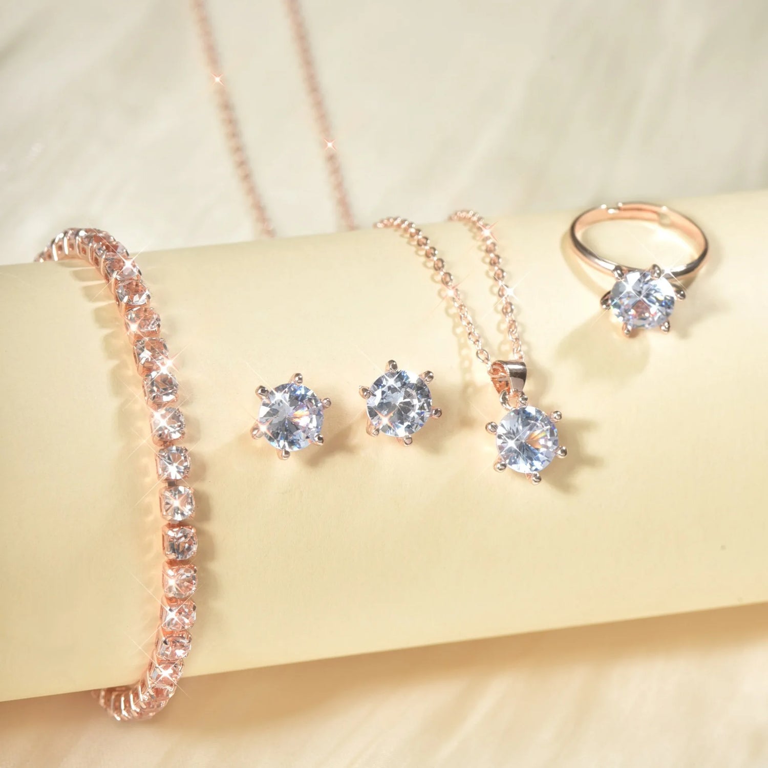 Alt Tag: 5 piece crystal jewelry set for women rose gold bracelet stud earrings necklace pendant and ring with clear crystals