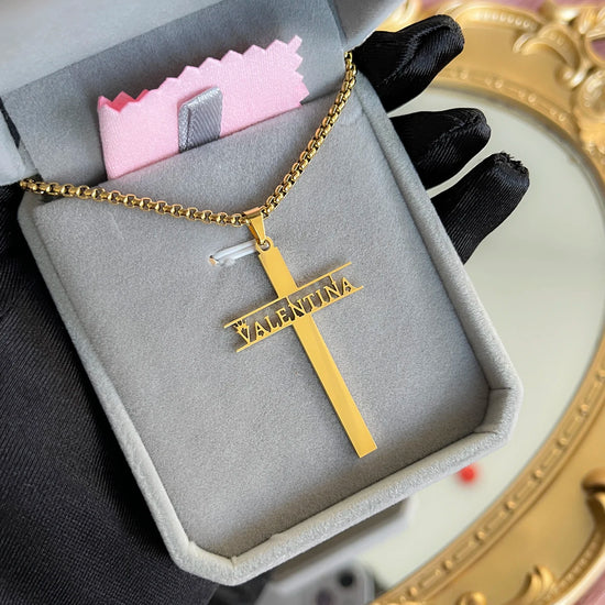 Custom stainless steel name necklace for women featuring a gold cross pendant with the name VALENTINA.