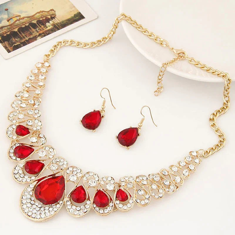 Alt Tag: luxury bridal crystal choker necklace with red teardrop crystals and rhinestones, gold chain, matching red crystal drop earrings