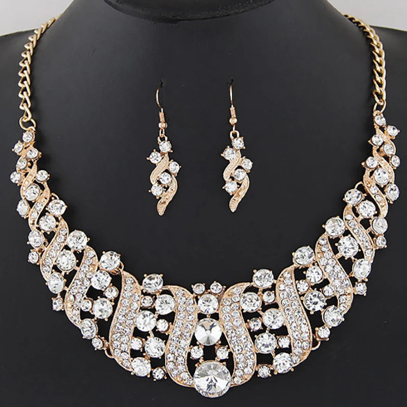 Alt Tag: crystal bridal necklace and earrings set with rhinestone statement necklace and matching drop earrings on display bust