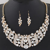 Alt Tag: crystal bridal necklace and earrings set with rhinestone statement necklace and matching drop earrings on display bust