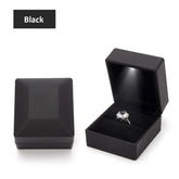 Alt Tag: Luxury black velvet LED velvet ring box with light jewelry display case for proposal engagement wedding