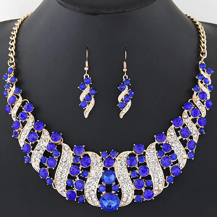 Alt Tag: crystal bridal necklace and earrings set with blue and clear rhinestones, gold-tone statement wedding jewelry set