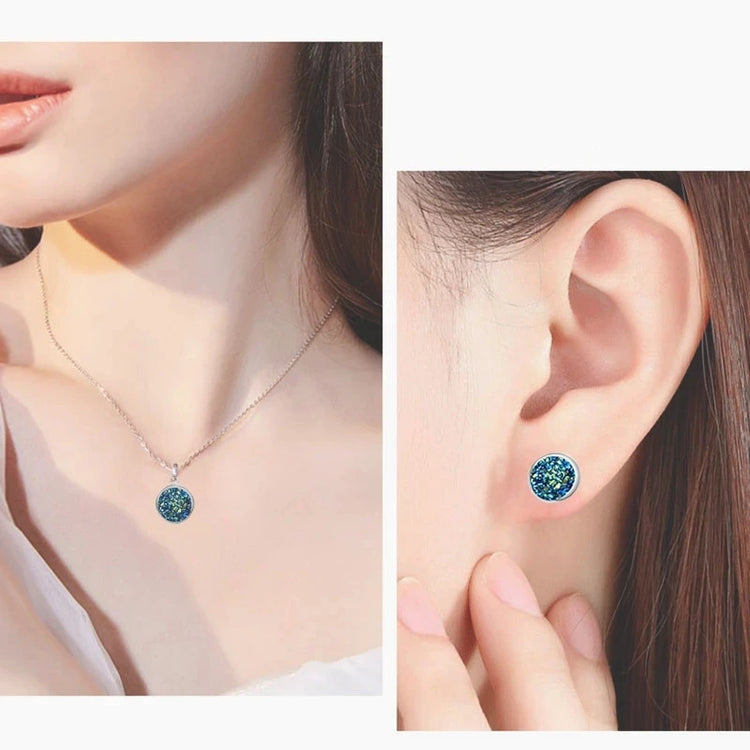 Alt Tag: silver plated rhinestone jewelry set for women featuring silver pendant necklace and blue rhinestone stud earrings