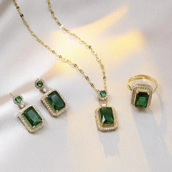 Alt Tag: 4 piece rhinestone bridal jewelry set with green crystal pendant necklace, matching earrings and ring in gold tone