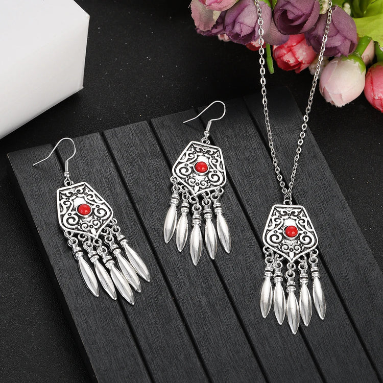 silver plated turquoise indian jewelry set necklace and drop earrings on black display board