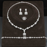 Alt Tag: rhinestone crystal bridal jewelry set with necklace, drop earrings, ring and bracelet in silver tone for wedding