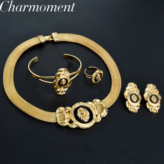 Alt Tag: 18k gold plated Dubai jewelry set for women featuring gold-tone necklace, bracelet, ring and earrings on black background