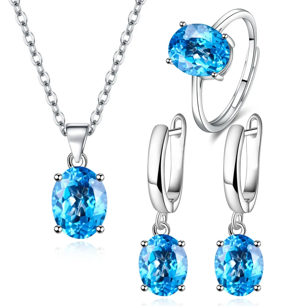 Alt Tag: 925 sterling silver bridal jewelry set with blue gemstone necklace pendant, ring and drop earrings