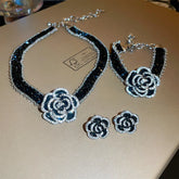 Alt Tag: crystal flower rhinestone choker necklace set with black ribbon, floral crystal pendant, matching bracelet and earrings jewelry set